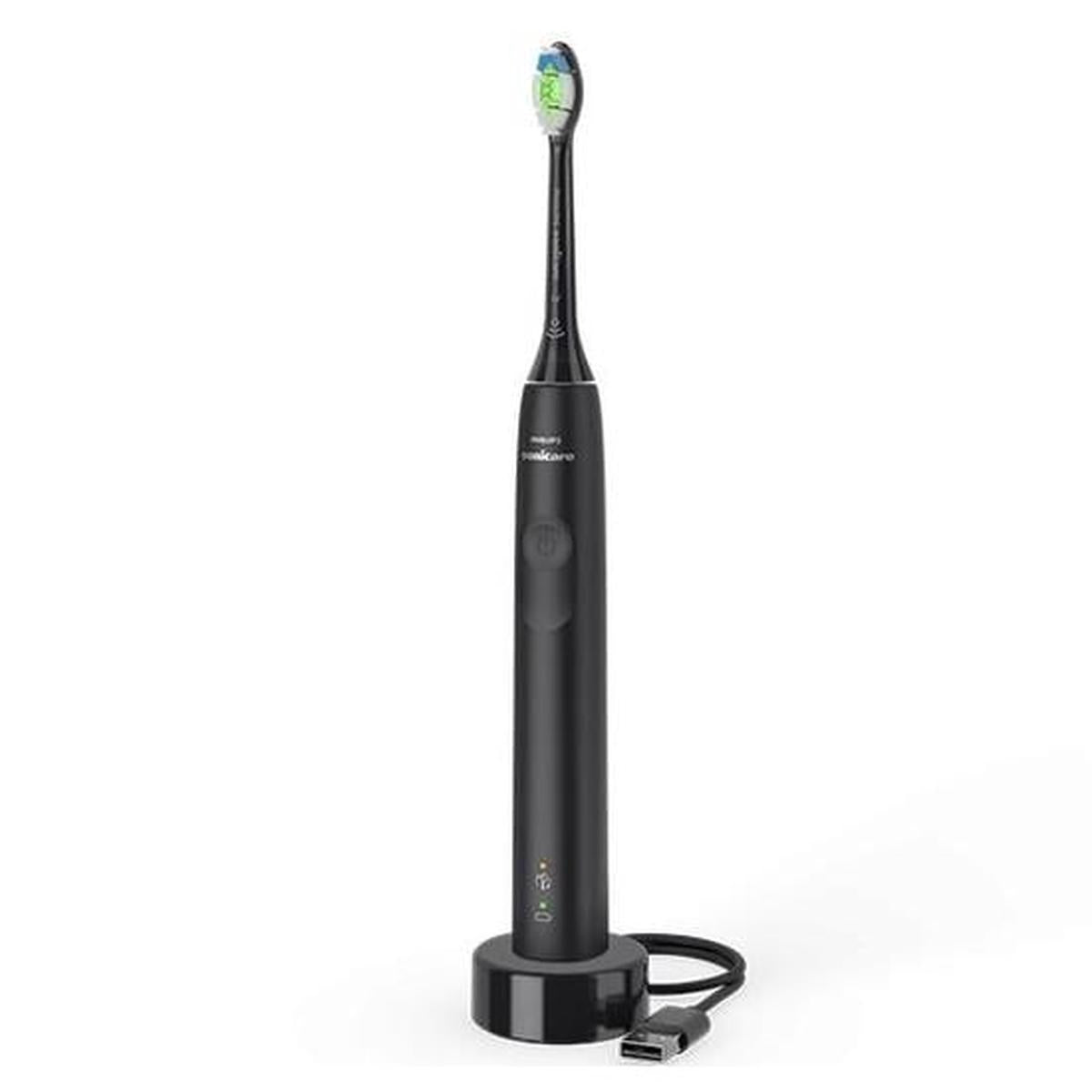 Philips Sonicare 4100 electric toothbrush in matte black with a charging base and USB cable on a white background.