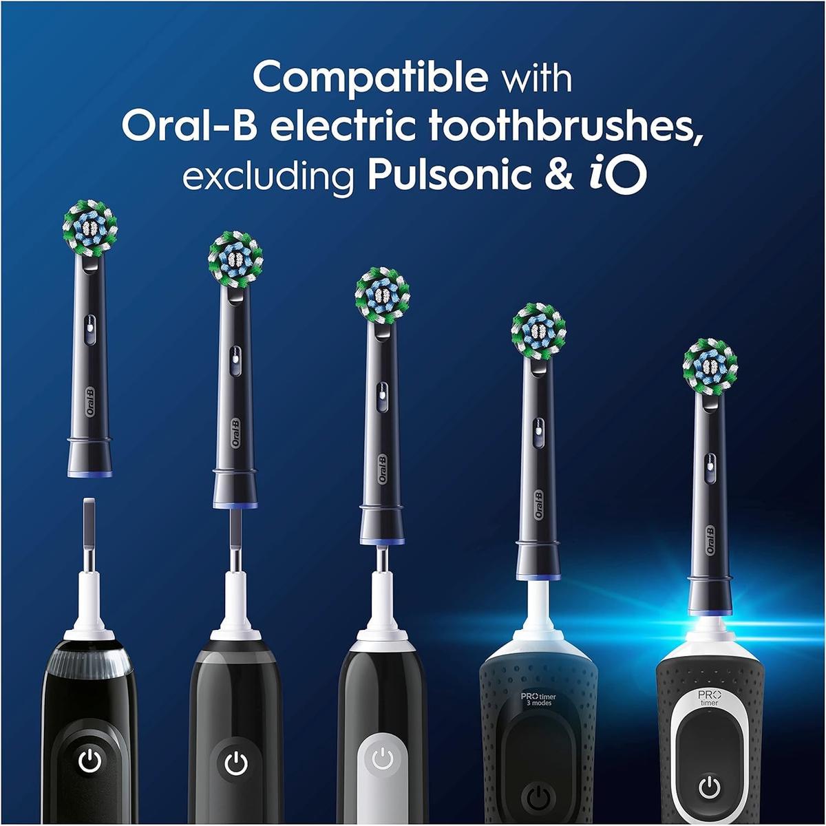 Four black Oral-B Cross Action replacement brush heads with angled X-shape bristles shown above compatible electric handles.