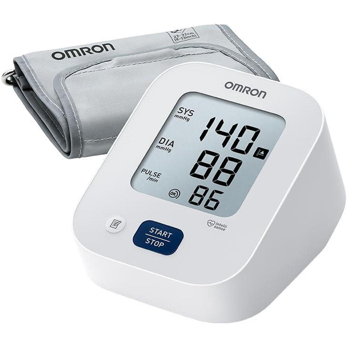 White OMRON M2 blood pressure monitor with digital display and grey upper arm cuff for home health tracking.