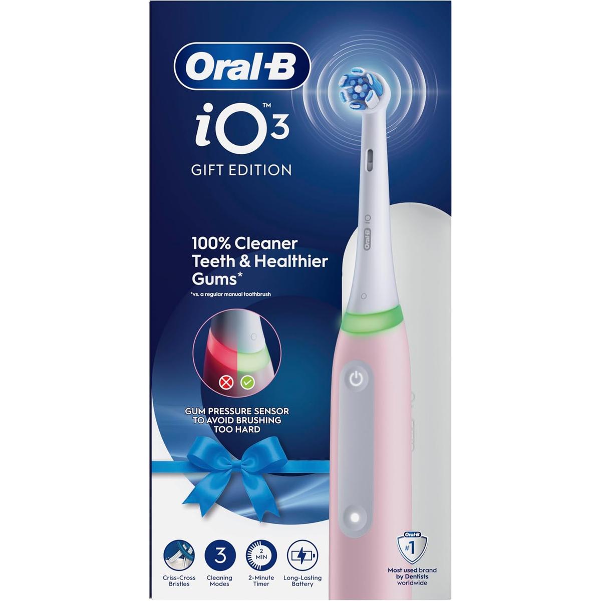 Oral-B iO3 electric toothbrush in pink with a round brush head, pressure sensor light ring, and travel case in gift packaging.