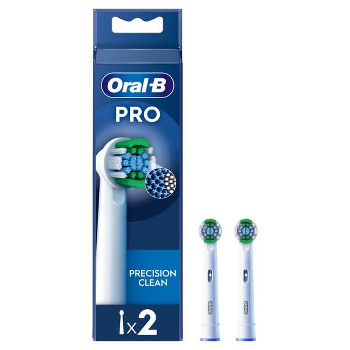 Two Oral-B Precision Clean white electric toothbrush heads with green and blue X-shape bristles in blue packaging.