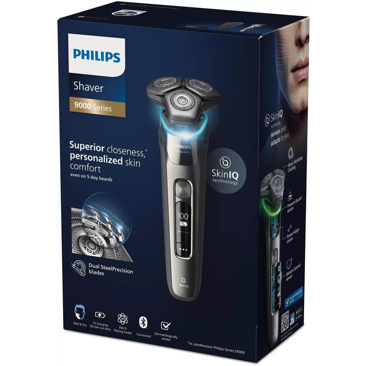 Philips Series 9000 electric shaver in metallic grey with triple rotary heads and digital display on branded product box.