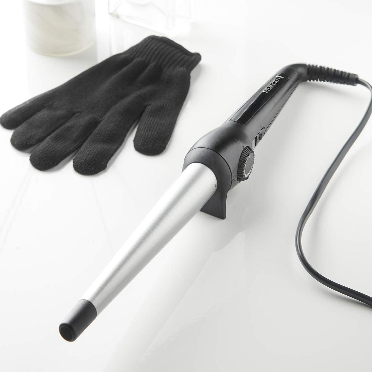 Remington curling wand with a tapered ceramic barrel, black handle, temperature dial, and included heat-resistant glove.