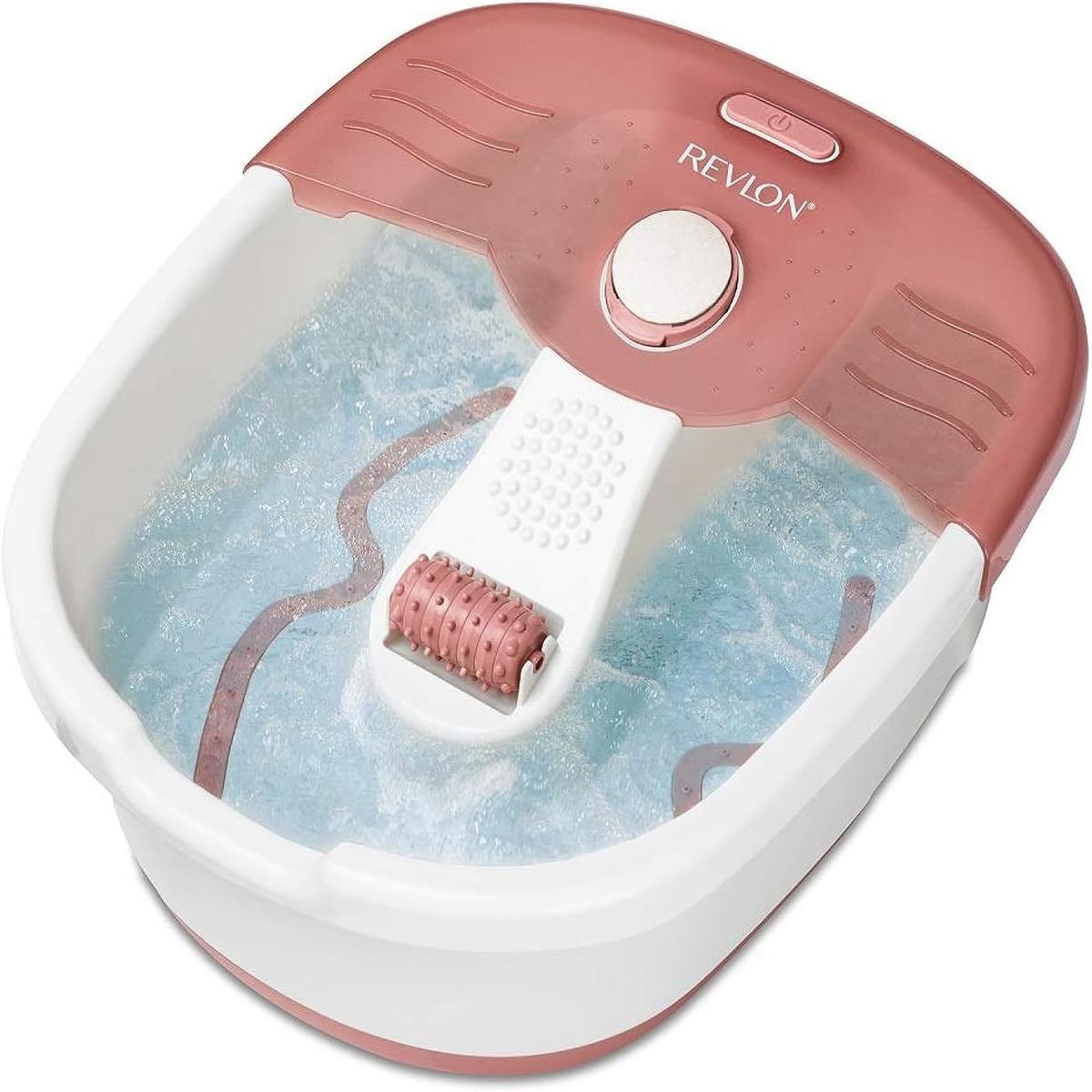 Revlon Pediprep foot spa in white and dusty rose with a bubbling water basin, central massage roller, and pumice stone attachment.