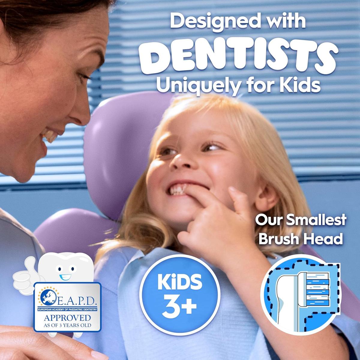 A dentist smiles at a young girl in a chair, highlighting the Oral-B Pro Kids electric toothbrush designed for ages 3 and up.