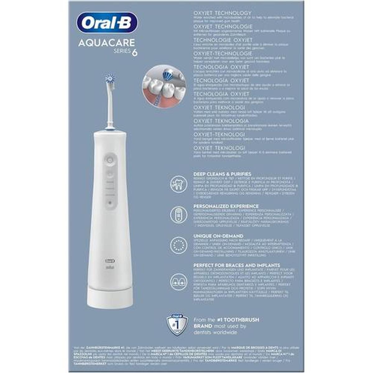 White Oral-B Aquacare Pro-Expert cordless dental irrigator with Oxyjet nozzle shown on product packaging with feature icons.