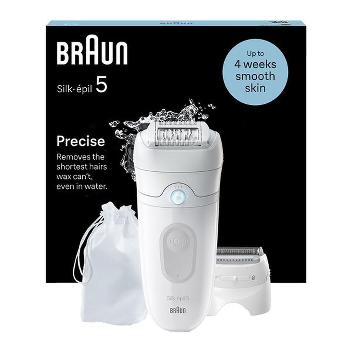 White Braun Silk-épil 5 wet and dry epilator with massage roller cap, shaver head, and storage pouch in front of product box.