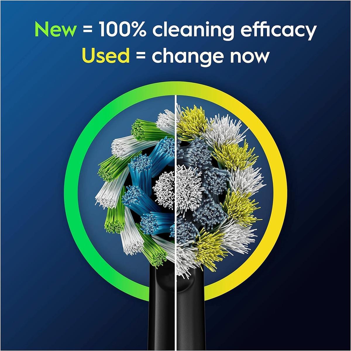 Oral-B black toothbrush head showing green bristles for new and yellow bristles for replacement indicator.