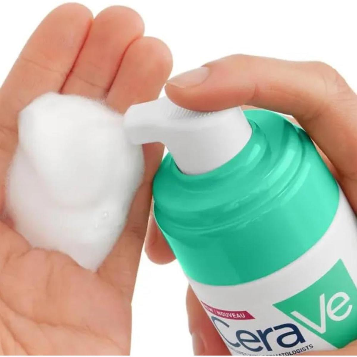 Hand pumping CeraVe Balancing Air Foam Cleanser to dispense white, airy foam into a palm for combination skin.