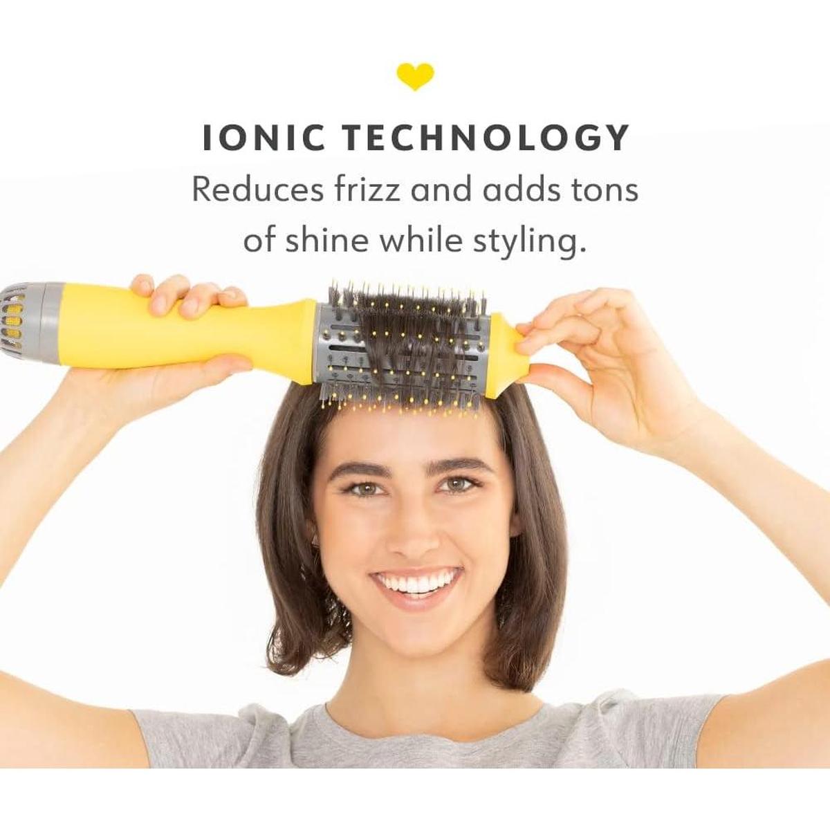 Woman styling short hair with a yellow Drybar Single Shot ionic oval blow-dryer brush for volume and shine.