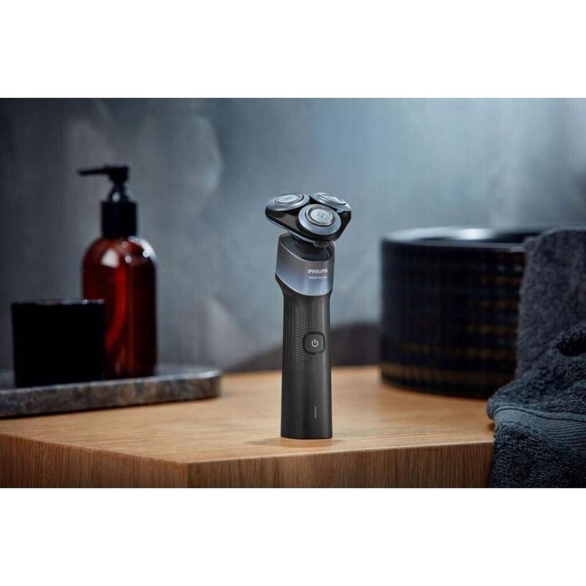 Philips 5000X Series electric shaver with a blue ergonomic handle and 360-degree flexible triple-head shaving system.