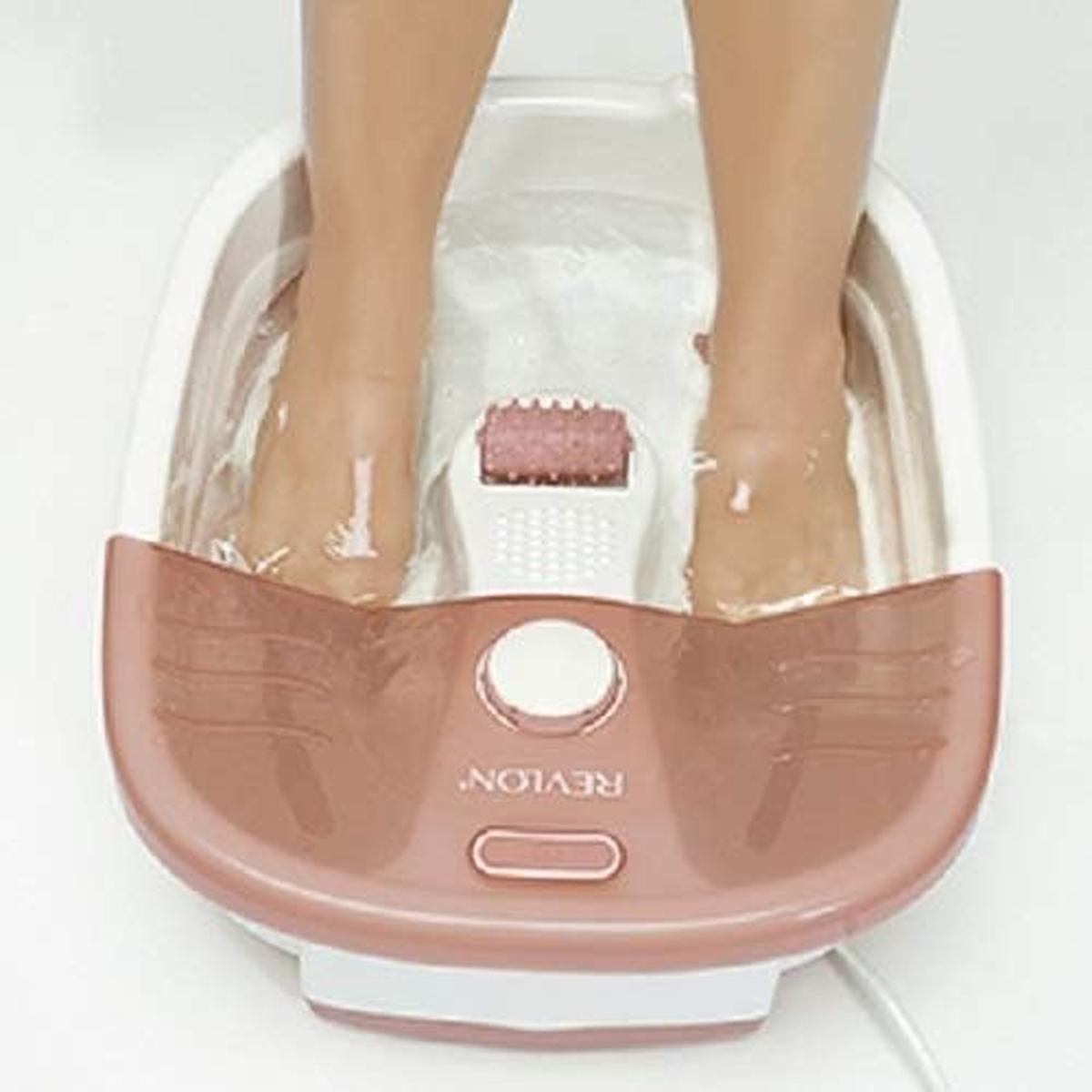 Revlon Pediprep foot spa in white and rose gold with a mechanical rolling massager and feet soaking in water.